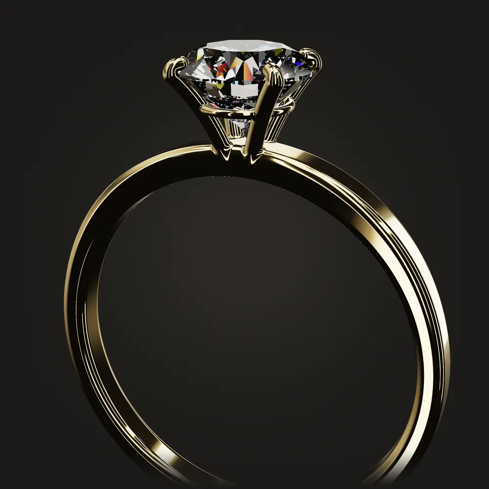 The finished ring: a round brilliant held by four claws on a plain polished band.